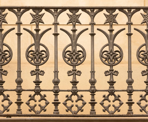Wrought iron grate with decorative floral patterns.