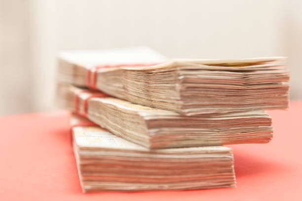 istock Stack of money is piled on top of each other 2158657483