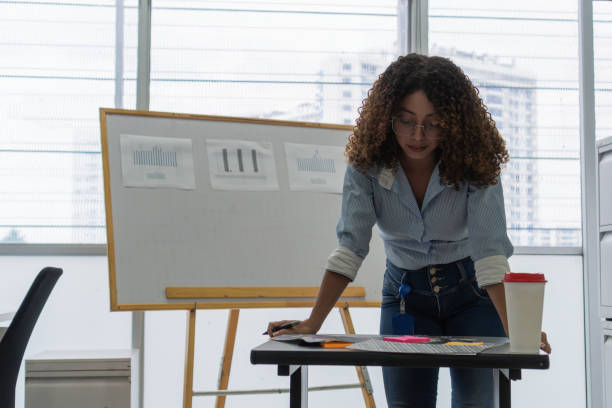 istock Latin Woman Working in Office with Documents 2158659104