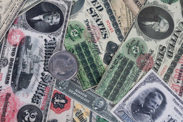 istock Old west period US banknotes and silver certificates with silver dollar coins 2158666832
