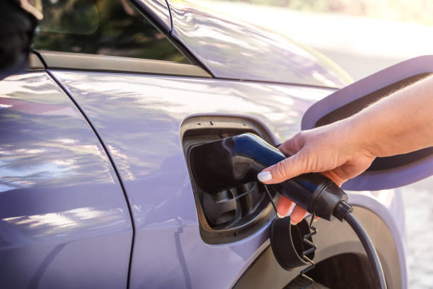 istock Woman hand puts the car on EV charging. 2158669002