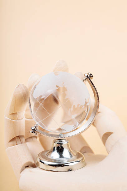 Wooden Hand Holding Globe, Technological Protection from Environmental Disasters