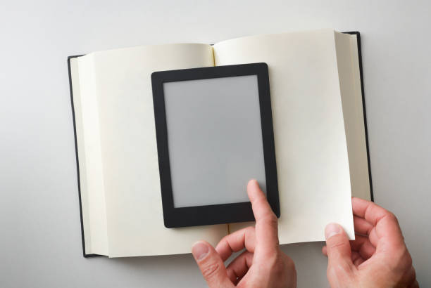 istock Concept of reading in electronic book compared to paper 2158671541