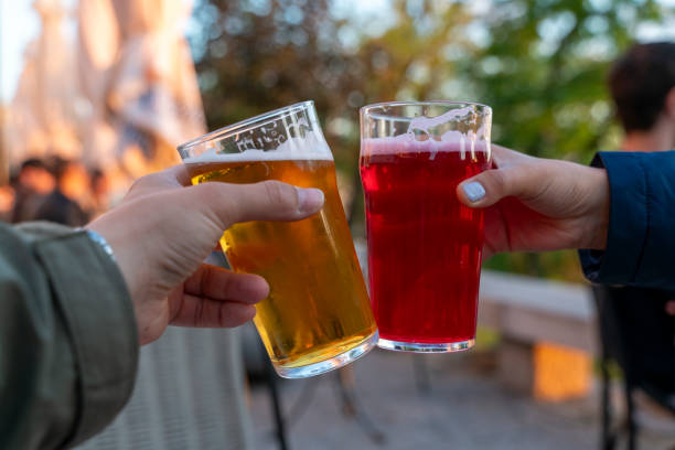 istock couple toasting with beer 2158673282