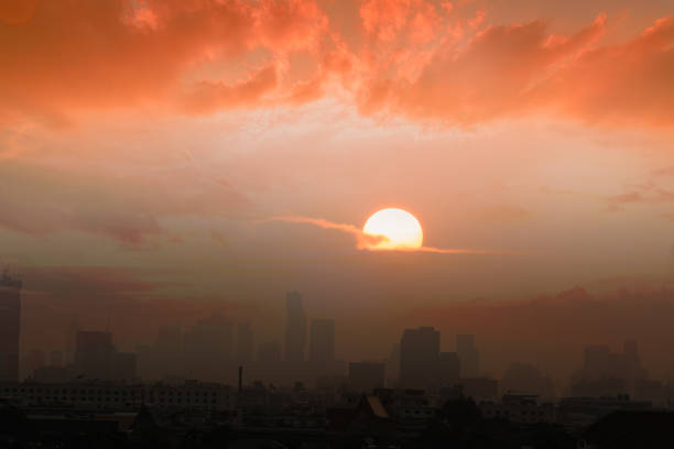 Sunset  with cityscape of building silhouette,At  twilight  in Bangkok ,Thailand