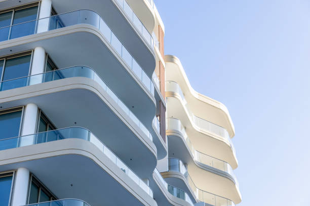 istock Brand new, modern apartment building, sky background with copy space 2158677678