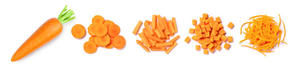 Set of carrots and carrot cut sliced isolated on white Set of carrots and carrot cut sliced isolated on white background. Top view, flat lay. pile of carrots stock pictures, royalty-free photos & images