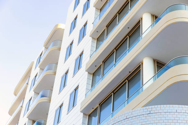 istock Closeup brand new, modern apartment building, low anglew view, background with copy space 2158678040