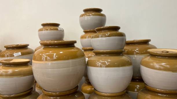 istock Chinese pickle jar, ceramic food storage containers or beige pots.biggest traditional handmade items with artistic decoration put on display for sale 2158678261
