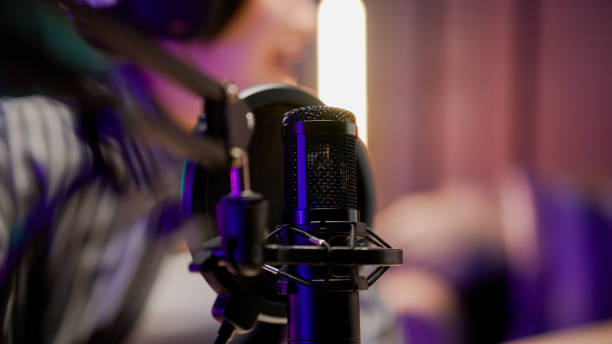 istock Young Asian woman sharing life experience with audience while holding a live podcast. 2158679732