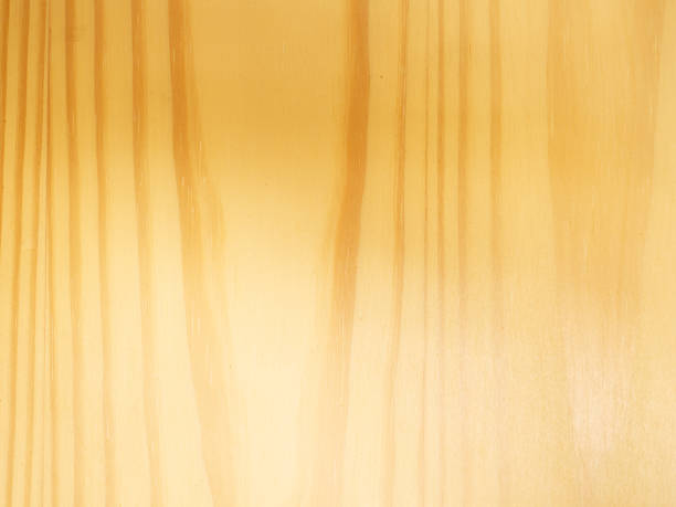Close-up of light wooden texture with natural grain patterns, ideal for backgrounds, design elements, or nature-themed projects.