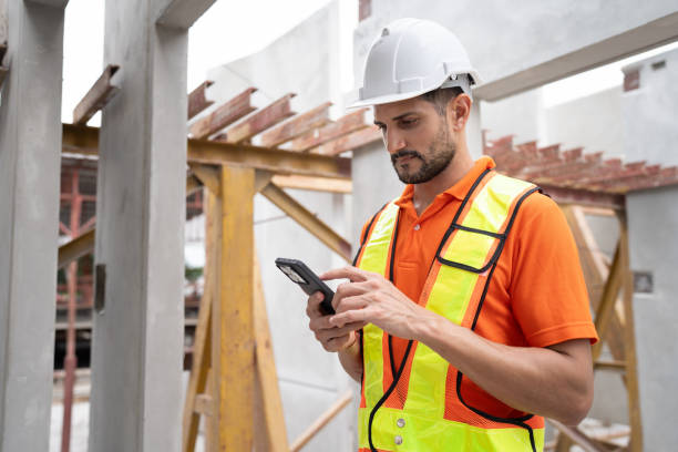 istock Portrait Hispanic latin engineer man use smartphone checking precast cement at precast cement outdoor factory 2158681412