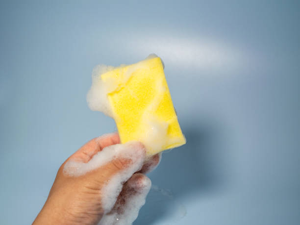istock Hand holding foamy cleaning sponge 2158681959