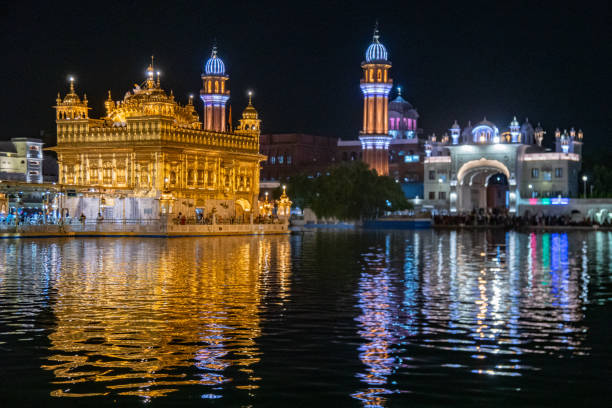istock At nighttime, the Golden Templeis reflected in the water, Amritsar, India 2158683525
