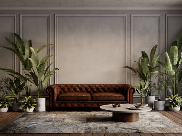 istock Loft gray classic interior with brown leather sofa, tropical potted plants, carpet, moldings, coffee table and decor. 3d render illustration mockup. 2158685270