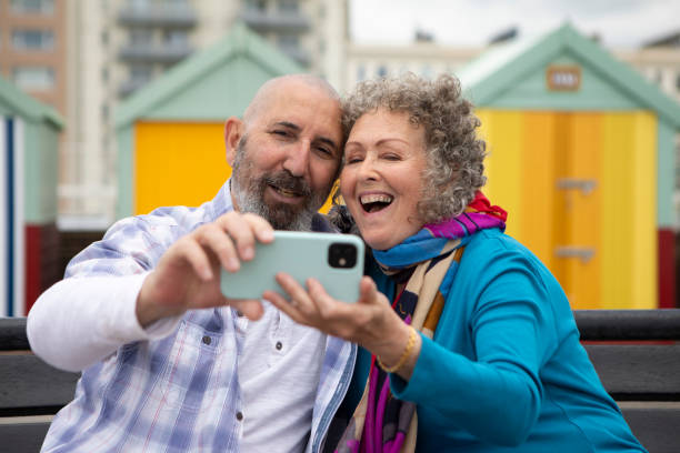 istock Senior couple making a video call on a smart phone 2158685294