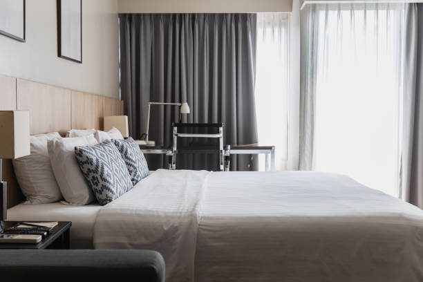 Modern and Cozy Bedroom Interior With Desk and Large Windows