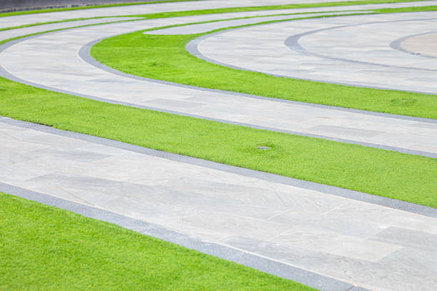 istock Curve foot path walk way in central garden park grass public area. 2158689661