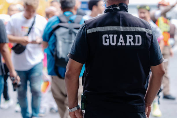 istock closeup security guard man in public area standing secure people or place outdoor. 2158689689