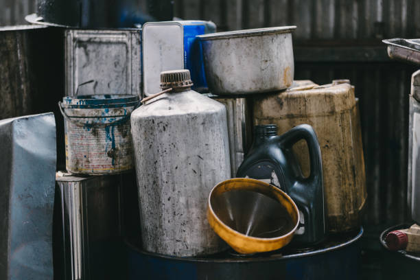 istock Black old used dirty motor oil in garage liquid waste from engine drain dump impact environment 2158689698