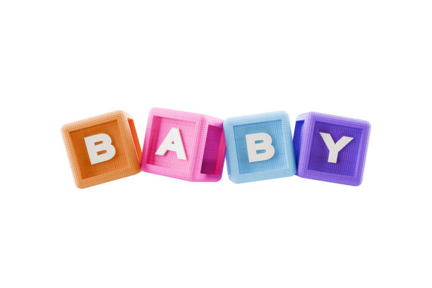 Photograph of a baby crawling towards blocks spelling out the word teach. The blocks are in focus in the foreground and the baby is slightly out of focus in the background.