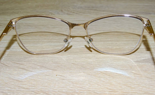 istock Eye glasses on a wooden background 2158690252