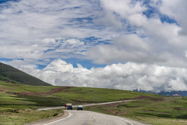 istock Highland meadows, mountains and roads in cloudy weather 2158695156