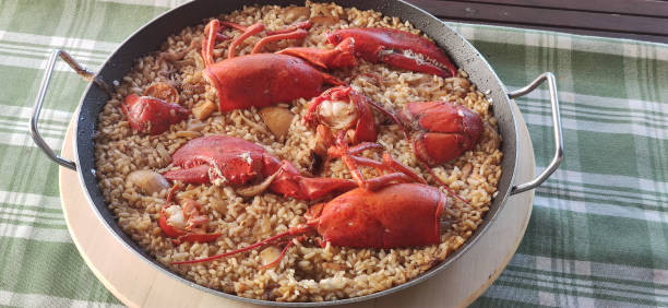 A Paella plate at spanish restaurant, night view.
