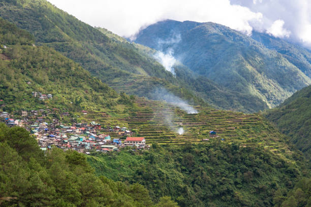 istock A scenic view of a remote mountain village amid terraced fields, with clouds drifting over green hills. At the Bay-yo Rice Terraces, near the town of Bontoc, Mountain Province. 2158696022