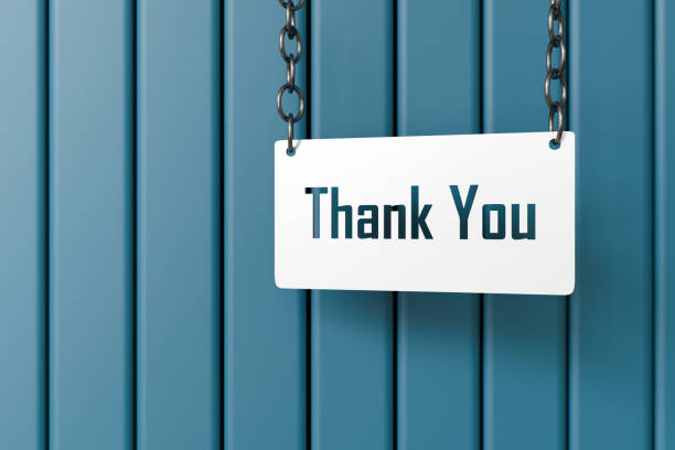 Thank you placard on blue wooden background with chains.