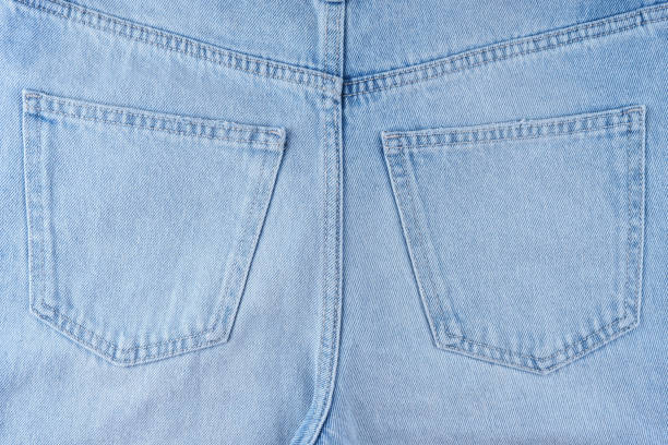 istock Back side of blue jeans pants, two back pockets close up 2158700598