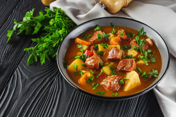 istock fragrant thick goulash soup on a black wooden rustic background 2158702008