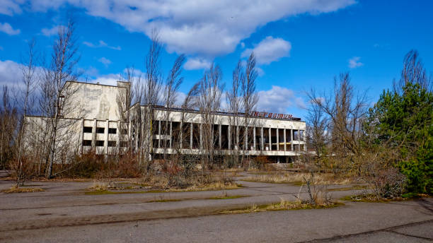 istock A dilapidated building with broken windows, surrounded by overgrown vegetation and bare trees. The Energetik Palace of Culture is a now abandoned multifunctional palace of culture in Pripyat. 2158702334