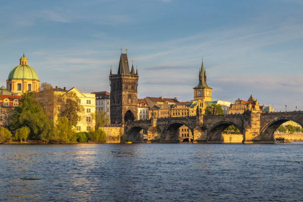 istock Charles Bridge with towers in Prague in beautiful light at sunset 2158702416