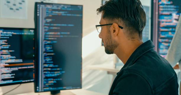 istock Closeup of tech team professionals collaborate working together on software development in contemporary office. Software developer, artificial intelligence and programming. 2158703020