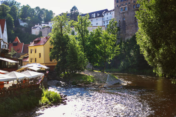 Cesky Krumlov, Czech Republic. Landscape of the river and the rapid with some boats on floating on it