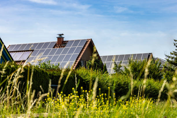 istock Houses with solar panels on a summer day 2158705025