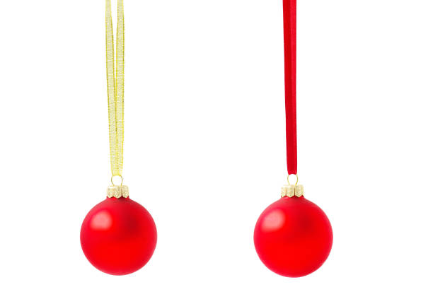 Christmas ball hanging with ribbons on white background