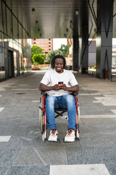 istock Smiling African American man using a smart phone outdoors 2158707375