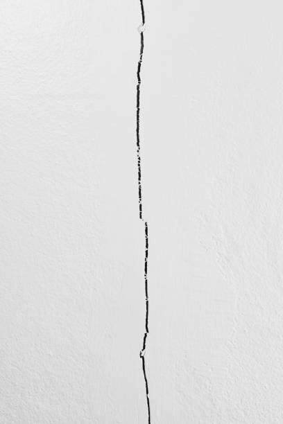 istock Deep fractured concrete wall of the building caused 2158707945