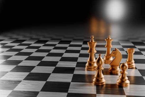 istock Gold chess pieces on a black and white chessboard with a blurred background.3d rendering 2158709158