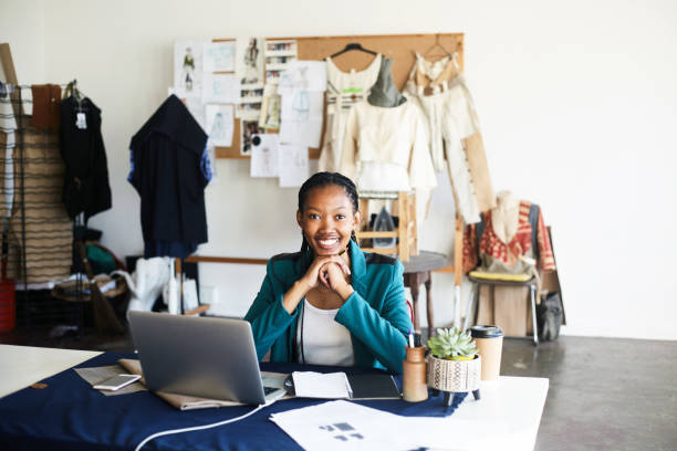 istock Radiant at Work Smiles from Her Desk 2158711001