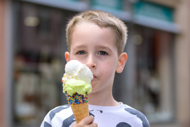 istock Boy Enjoying Ice Cream with Sprinkles 2158711079