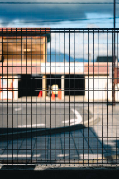 istock Urban Scene through a Metal Fence 2158711476