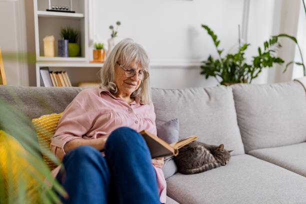 istock Charming Senior Woman Reading 2158711715