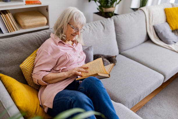 istock Charming Senior Woman Reading 2158711803