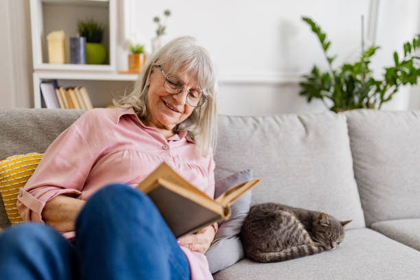 istock Charming Senior Woman Reading 2158711913