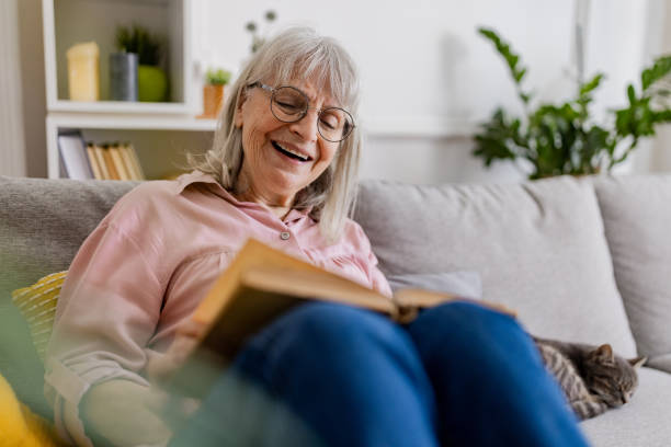 istock Charming Senior Woman Reading 2158712013