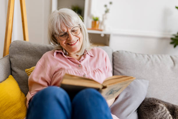 istock Charming Senior Woman Reading 2158712043