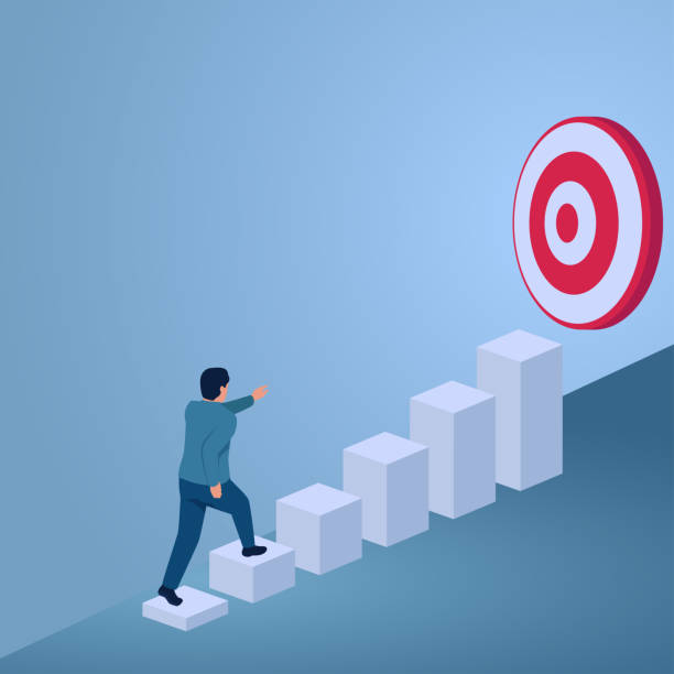 istock A man climbs a ladder of graphic blocks rising towards a large target, an illustration of goal achievement. 2158713983